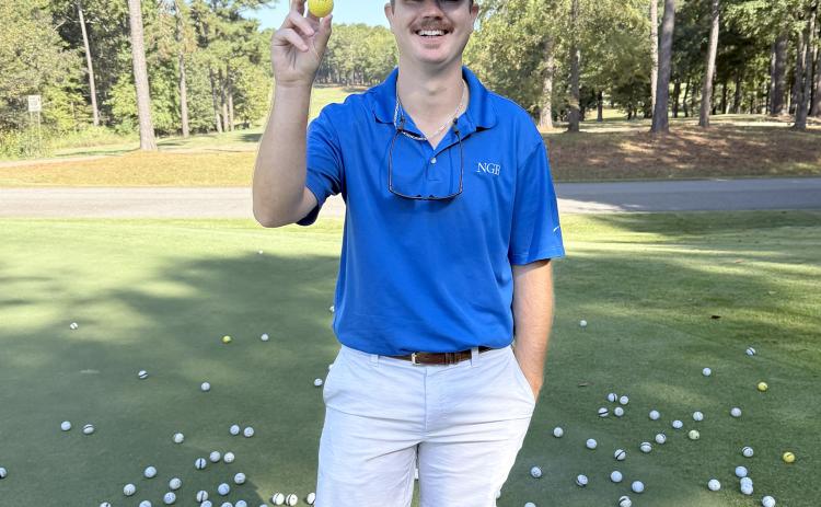 Tournament volunteer Colton Moon pulled Jason Floyd's golf ball during the annual golf ball drop, making Floyd the winner of the $500 grand prize.