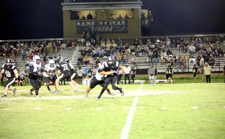 Kaden Montgomery (17) forces a fumble to seal Elbert’s 16-6 road victory over Commerce on Sept. 26. (Photo by Bo Underwood)
