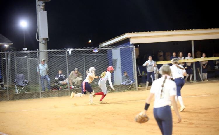 Ky Dubose (11) tags a runner out. (Photo by Bo Underwood)
