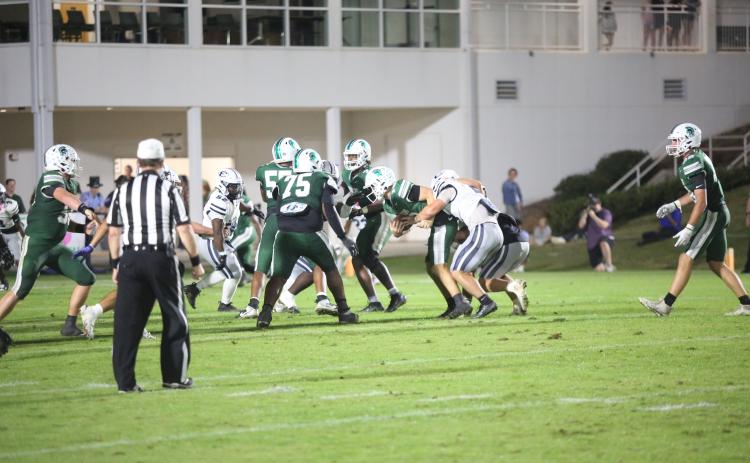 Lincoln Blackmon (2) sacks the quarterback in Elbert County's 48-14 loss to Athens Academy on Oct. 17. (Photo by Bo Underwood)