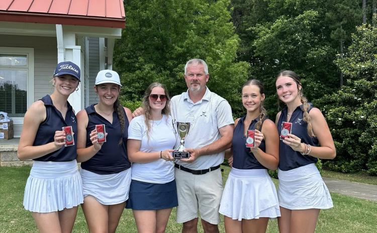 Girls golf coach Larry Kesler (third from right) celebrates with his girls team after finishing second in the state in the GHSA Class A Division 1 State Championship match at Arrowhead Pointe in May. (Photo courtesy of Elbert County Golf)
