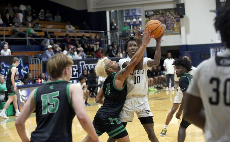 A.J. Brown (10) goes up for a basket in the lane against Franklin County . (File photo  by Bo Underwood)
