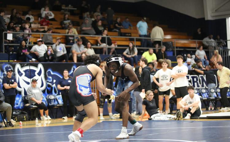 Javares Bowman (above) offers a grin as he faces his opponent (Photo by Mark Wells)