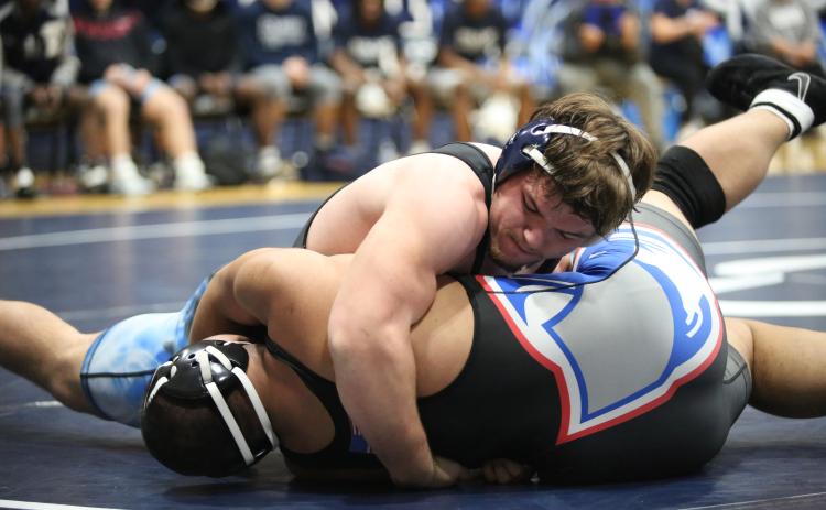 Lincoln Blackmon and Cruz Floyd earned area titles at AAAAAAA area traditionals. (File photos by Bo Underwood and Mark Wells)