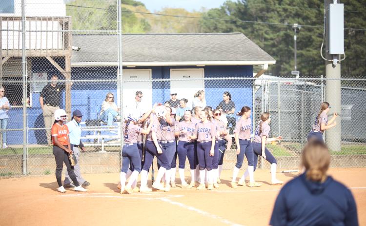 The Elbert County dugout celebrates a home run by Audrey Lunsford. (Photo by Bo Underwood)