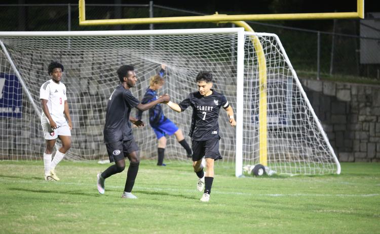 Pablo Medellin (right) and Judeson Lexima (right) celebrate a goal. (Photo by Bo Underwood)
