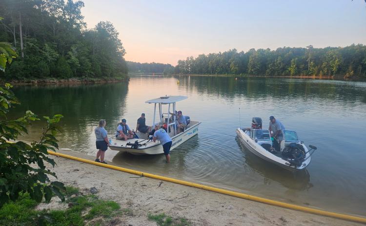 Elbert County EMS Assistant Director Beth Seymour (far left) and the Elbert County dive team put their boat in the water on Lake Richard B. Russell. (Photo courtesy of Justin Hobbs)
