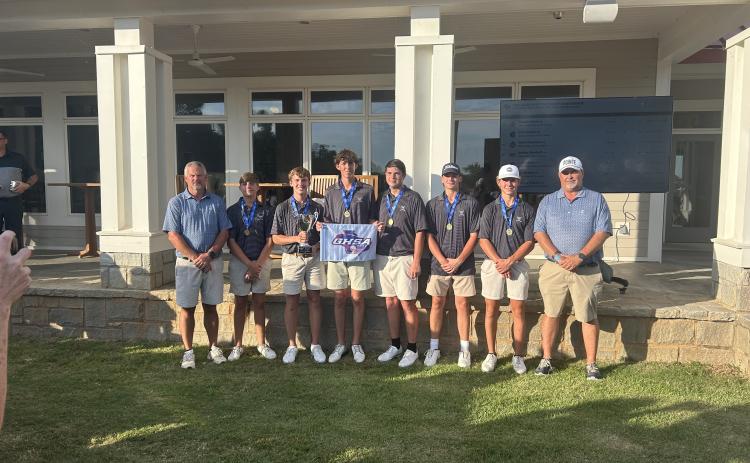 The Elbert County golf team (L-R), head coach Larry Kesler, Carson Amabile, Madden Drake, Landen Adams, Nolan Henderson, Ty Johnson, Maddox Adams and assistant coach Sandy Thornton won their second straight GHSA state championship Tuesday. (Photo by Bo Underwood)
