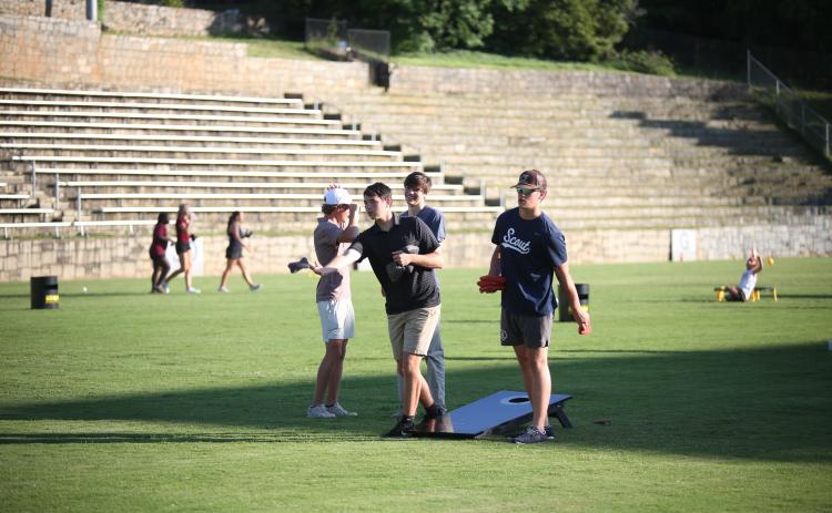 Members of Elbert County's golf team play cornhole at last year's state championship welcome party. (Photo by Bo Underwood)