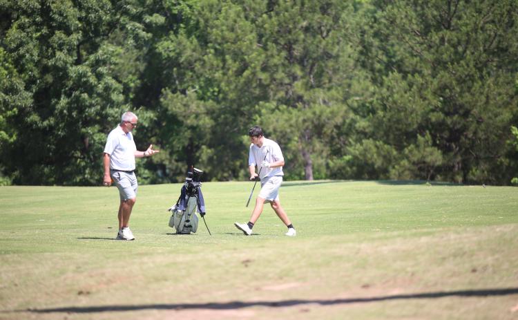 Larry Kesler coaches Nolan Henderson during the GHSA Class A Division 1 championship May 18. (Photo by Bo Underwood)