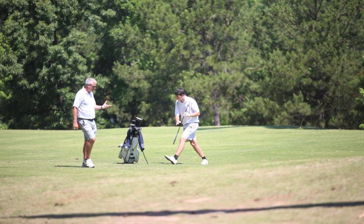 Larry Kesler coaches Nolan Henderson during the GHSA Class A Division 1 championship May 18. (Photo by Bo Underwood)