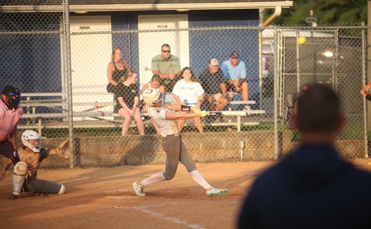 Bryleigh Dickerson hits a home run against Prince Avenue Christian. (Photo by Bo Underwood)