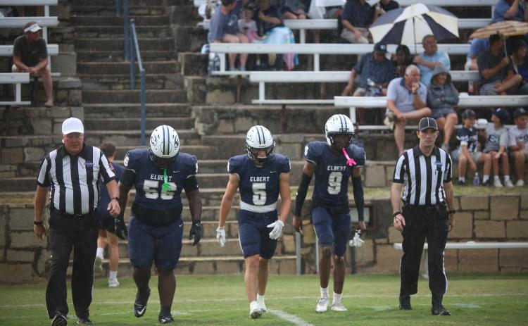 Elbert County's captains, (L-R) Jerrell Sims, Jackson Black and Braylen Huff, take the field. (Photo by Bo Underwood)