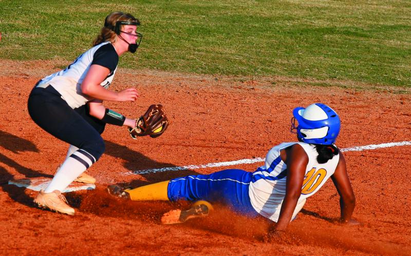 Lady Blue Devil junior infielder Ellie Jourolmon (left) tags out Lady Tiger Kariah Smith during Elbert County's 10-8 victory over Washington-Wilkes Aug. 6 on King Field in Elberton. (Photo by Cary Best)