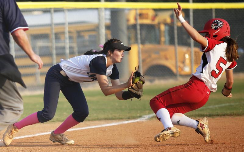 Junior Lady Diamond Madelyn Dias (left) tags Lady Redskin Cara Mayfield in the fifth inning of Elbert County’s 3-2 Region 8-AA win over Social Circle Sept. 12 on King Field in Elberton. (Photo by Cary Best) 
