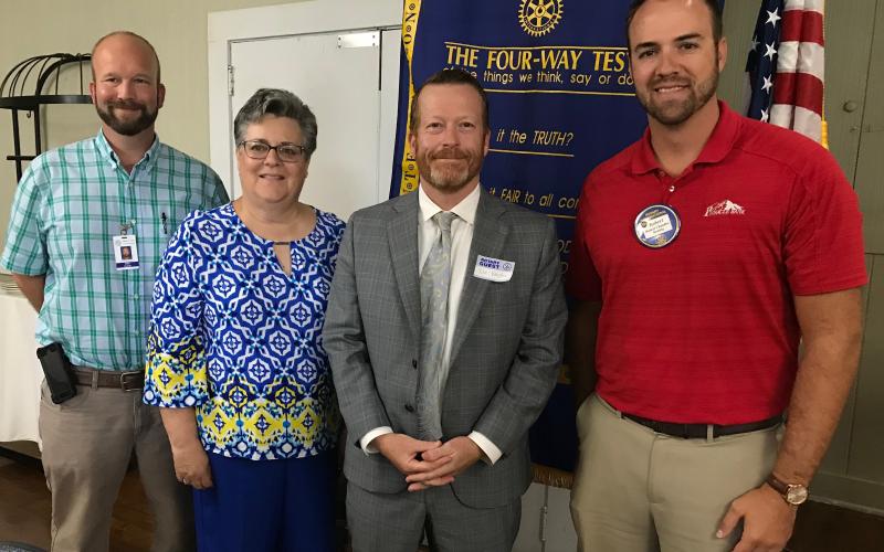 At last week’s Rotary Club of Elberton meeting County Commission Chairman Lee Vaughn (second from right) discussed several subjects, including widening of Highway 17. Shown with Vaughn after the meeting are (L-R) County Code Enforcement Officer Allen Hulme, Rotarian Janet Wiley and (right) Rotary President Robert Chandler. (Photo by Jones)