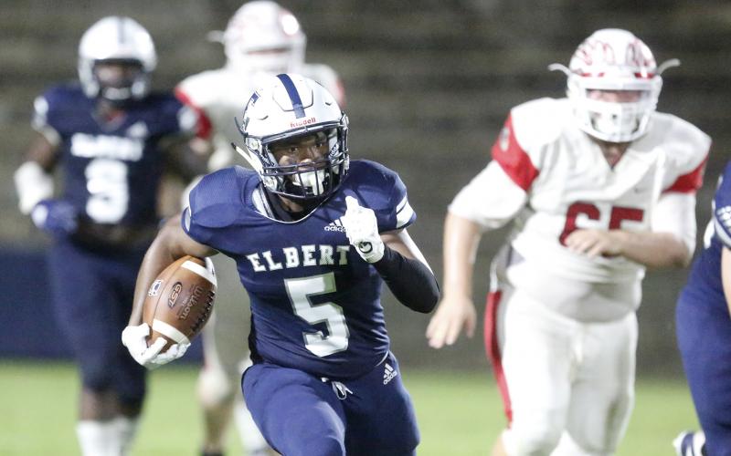 Blue Devil junior running back C.J. Tate rushes for an 80-yard touchdown during Elbert County’s 56-7 region win over Social Circle Friday night Sept. 27 in the Granite Bowl in Elberton (Photo by Cary Best).