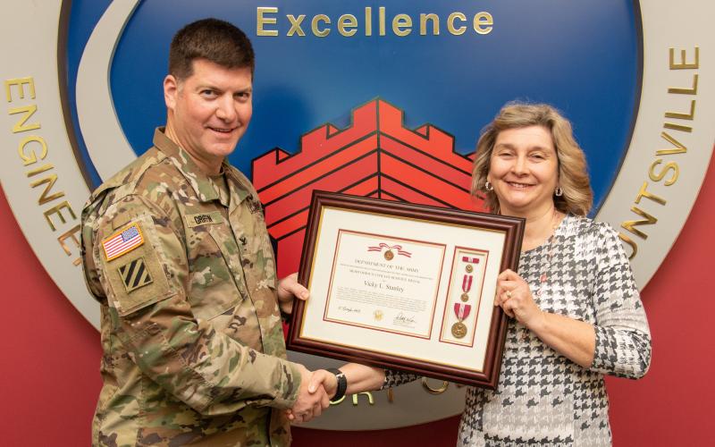 Vicky Stanley was presented the Meritorious Civilian Service Award by Col. Marvin Griffin, Commander, U.S. Army Engineering and Support Center on Jan. 13 in Huntsville, Alabama.  