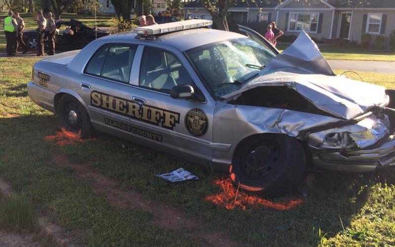 An Elbert County woman, Heather Ratliff Payton, 31, was killed during this accident involving an Elbert County Sheriff’s vehicle (foreground) in April of 2017. Payton’s vehicle, in the background, rotated counter-clockwise 180 degrees after impact and she was thrown from the vehicle, according to a report of the accident released by the Georgia State Patrol. (Photo by Jones)