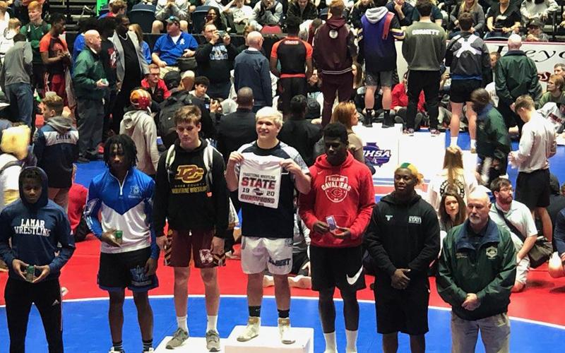 Mat Devil senior Brice Noggle (center) won the 182-pound state title during the Georgia High School Association’s 2020 State Traditional Wrestling Championships Feb. 13-15 in Macon.