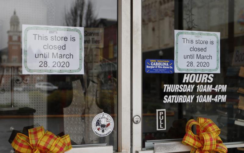 C&M Thrift Store posted signs on their doors to let customers know they would be closed until March 28. (Photo by Scoggins)