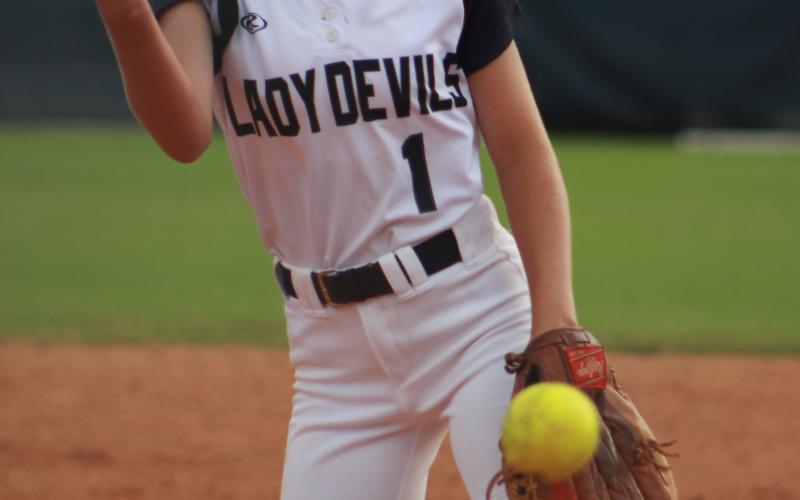 Sophomore Pitcher Jaynee Webb opened the Lady Devils softball game against Oconee Monday night at Wesley King Field. The team will travel to Prince Avenue Thursday for a 5 p.m. game. (Photo by Scoggins) 