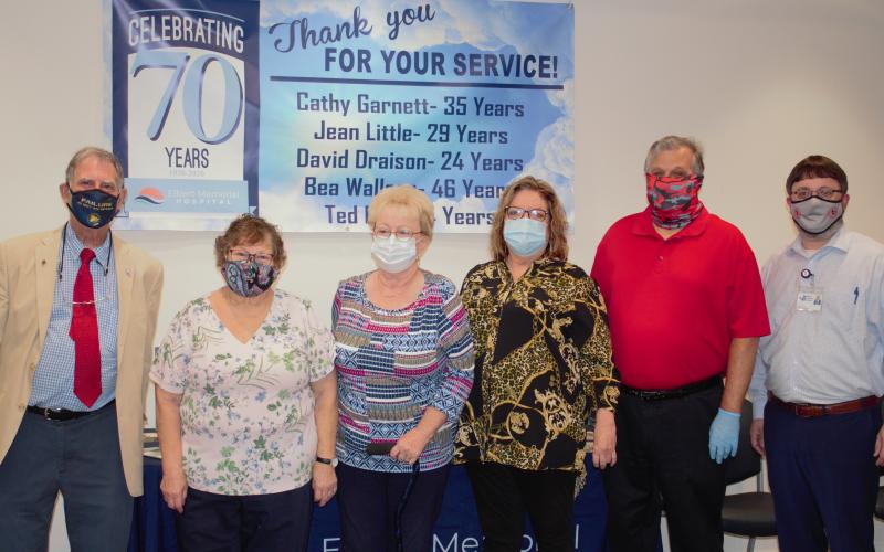 Five employees at Elbert Memorial Hospital are retiring with a combined 141 years of experience are (L-R) David Draisen, Bea Wallace, Jean Little, Cathy Garnett and Ted Dove. At the end of the line is EMH Chief Executive Officer Kerry Trapnell.
