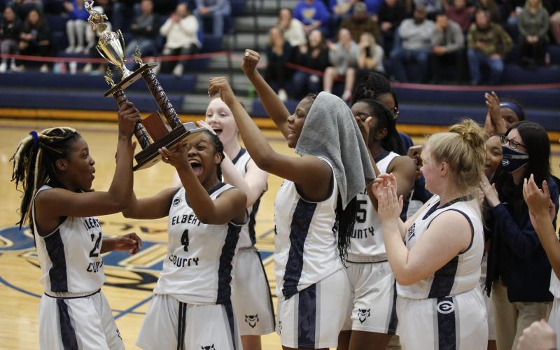 Lady Devils Jamia and Jameria Allen, Lilly Ray and Brenasia Faust celebrate the Lady Devils' Region Championship win at Banks County High School Thursday, Feb. 18. (Photo by Scoggins) 