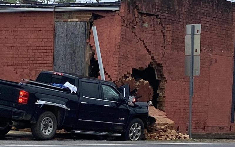 A single vehicle accident cause damage to the old Wray’s Drug Store building on the Bowman Square Sunday morning. (Photo courtesy of Elbert County Emergency Services)