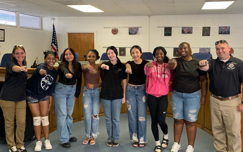 Pictured with their rings are (L-R) Nicole “Drill Mama” Ulrich, Team Leader De’Asia Kinsey, Natasha DeLeon, Chrisiya Harris, Jaelyn Massey, Jolette Medina-Galvan, Ke’miyah Teasley, Co-Captain Nakira Baker and Sgt. 1st Class Daniel Ulrich. Not pictured are Team Captain Lucas Vang and Kaleigha Montgomery. (Photo by Wells)
