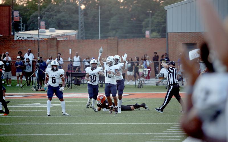 Elbert County Blue Devils (L-R) Trevion Swinger, Miguel Rodriguez, D.J. Fortson and Reunte Tucker celebrate after Fortson recovered a Hart County fumble. Elbert went on to win the game 24-14 and are ranked No. 4 in Class A Division 1 by the Atlanta Journal-Constitution. (Photo by Wells)