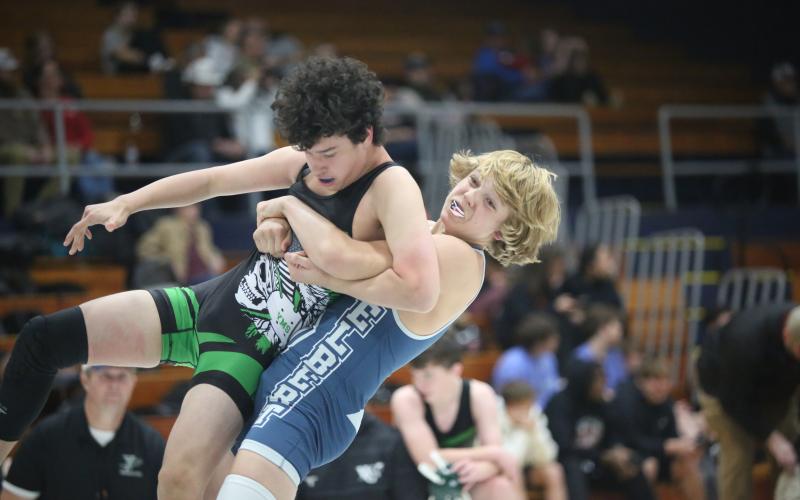 Patrick Castonguay throws his opponent to the mat. (Photo by Wells)
