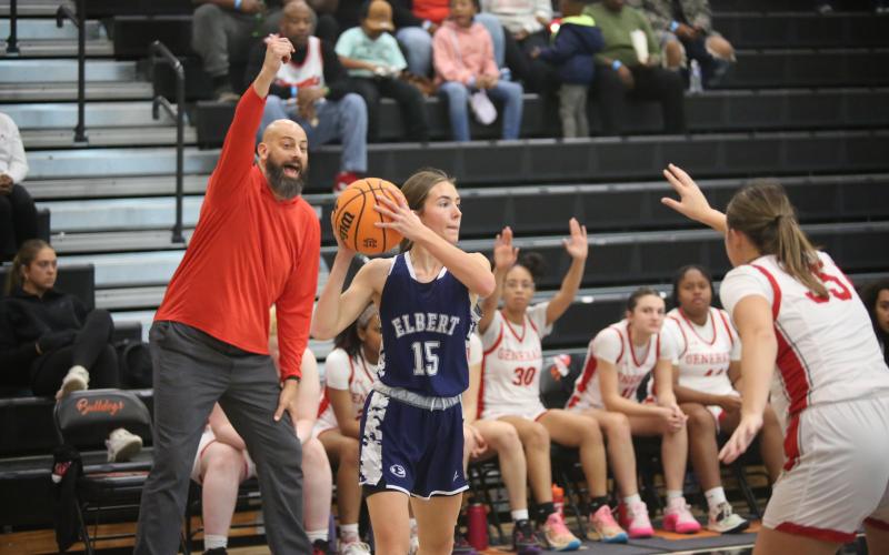 Reagan Baker looks for a pass while the Wade Hampton coach adjusts his players. (Photo by Wells)