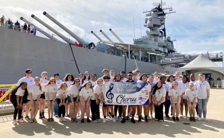 The Elbert County Chorus experienced a once-in-a-lifetime five-day trip to Hawaii and performed during the 81st annual commemoration of Pearl Harbor Wednesday, Dec. 7. Pictured in front of the U.S.S. Missouri Memorial at the Pearl Harbor Memorial in Honolulu, Hawaii are Elbert County High School Chorus members, Director Allyson Dye and the school’s tour guide.