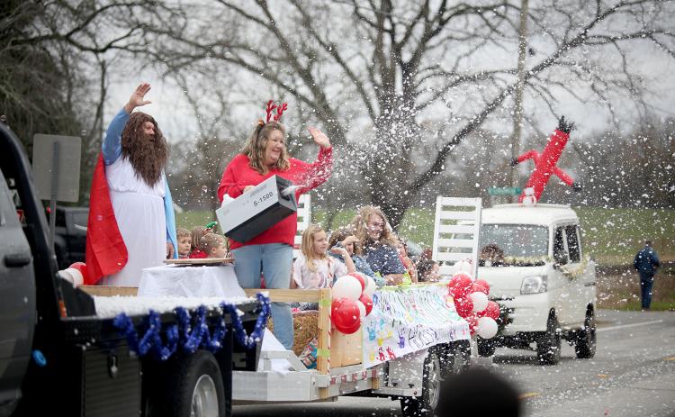 A float from Holly Springs Baptist Church brought ‘snow’ to the Bowman Christmas parade through the use of a snow machine Saturday, Dec. 10. See more photos from the festive parade on page 16. (Photo by Scoggins)