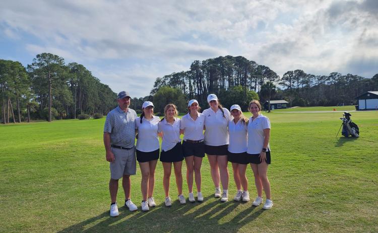 The Lady Devils golf team attended the Red Ryder Cup in Jekyll Island March 4. Pictured during the girls’ tournament are (L-R) Coach Larry Kesler, Avery Whitfield, Ellie Wheeler, Abby Bryant, Ava Dye, Addy Evans and Emalise Andrews.