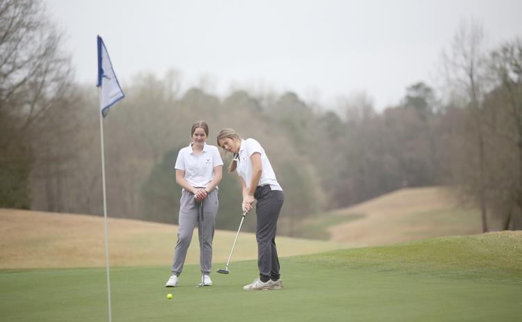 Lady Devils (L-R) Emalise Andrews and Ellie Wheeler finished in ninth place during the Blue Devil Shootout Feb. 25. (Photo by Wells)