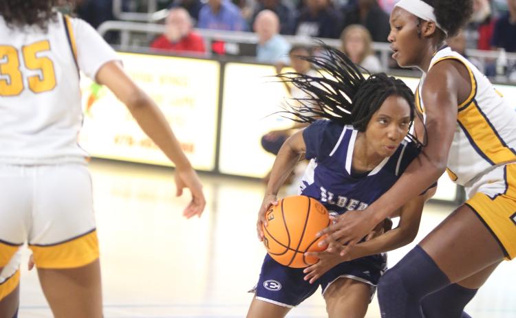 Senior Niya Moon fights past a Galloway defender during the Lady Devils’ 70-57 loss in the Final Four round of the GHSA State Tournament at Georgia College March 3. (Photo by Scoggins)