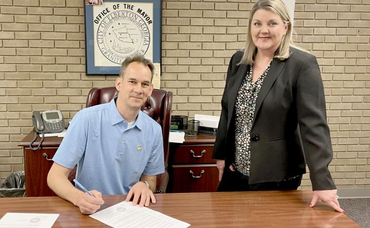Pictured as Elberton Mayor Daniel Graves signed a proclamation to recognize April as National Child Abuse Prevention Month are (L-R) Graves and Harmony House's Jennifer Rainer.