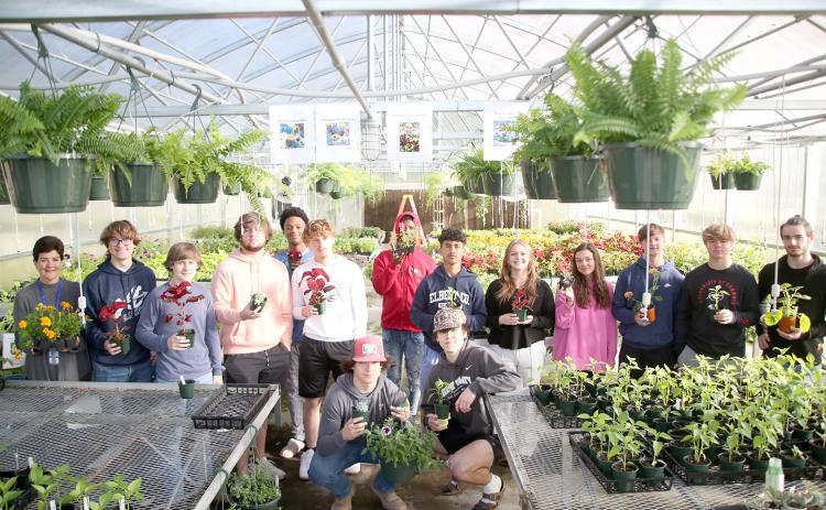 Students and instructors who helped grow the plants in Elbert County Comprehensive High School’s FFA Spring Plant Sale include (front row, L-R) Joey Biggs and Logan Carey and (back row L-R) Pat Moon, David Moore, Colsen Moore, Jaeden Smith, Malec Scarborough, Jayeveon Franklin, Jose Rodriguez, Taryn Hurndon, Kendall Dale, Conner Holland, Hayden Marunich and Asher Jones. (Photo by Wells)  Front Row L-R Joey Biggs and Logan Carey