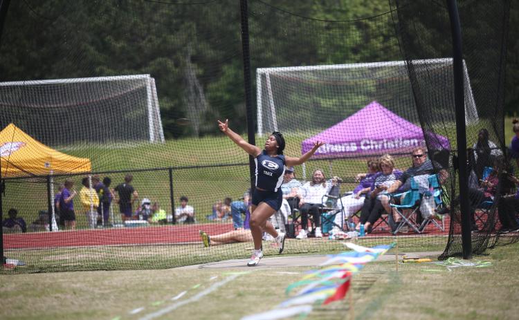 Lady Devil Marika Glaze qualified for the upcoming sectional meet in Barnesville May 6 after she won the region championship in discus with a throw of 108 feet, 1 inch. Head Coach Sid Smith said Glaze is the No. 1 discus thrower in the state for Class A Division 1.  (Photo by Wells) 