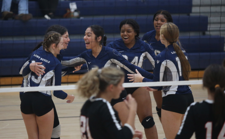 The Volley Devils celebrate after scoring a point against Rabun Couinty Sept. 28. The Lady Devils are set to face Barrow Arts and Sciences Academy in the area tournament Oct. 4. (Photo by Wells)
