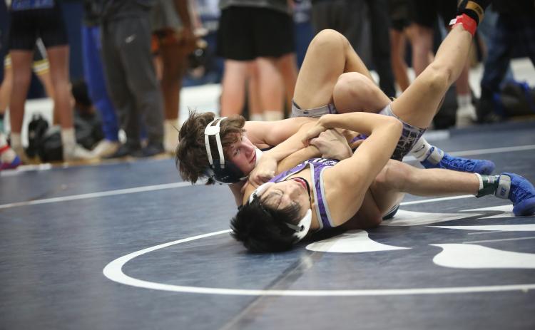 Carter Fleming fights to pin an opponent during the Granite City Duals hosted by Elbert County Dec. 9. (File photo by Wells)