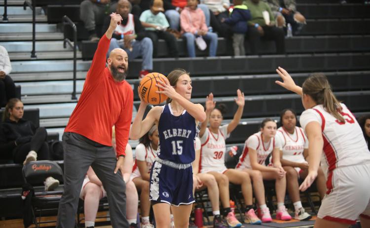 Reagan Baker looks for a pass while the Wade Hampton coach adjusts his players. (Photo by Wells)