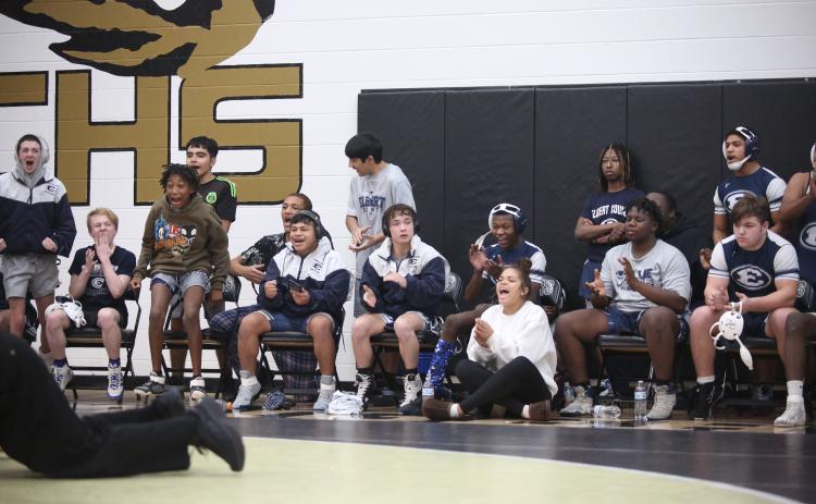 The Elbert bench reacts after teammate Brycin Hughes pins a Towns County wrestler during the area championship Jan. 13 at Commerce High School. (Photo by Wells)