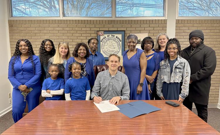 Pictured during the proclamation signing Saturday, Feb. 24 at Elberton City Hall are (L-R) Sherell Eberhardt, Tiara Eberhardt, Susie Payne, Xavier Strong, Layla Strong, Edna Eberhardt, Tyrene Turman, Mayor Daniel Graves, Pam Allen, Ruth Hunter, Heather Dent, Tiyah Turman and Terrence Eberhardt. (Photo courtesy of the City of Elberton)