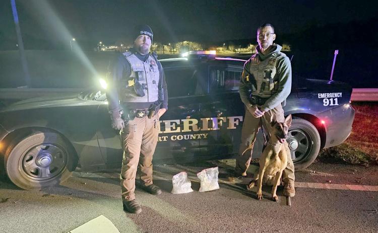 Pictured following a traffic stop turned drug bust of 4.5 pounds of methamphetamine laced with fentanyl, with an estimated street value of $200,000 are (L-R) Sg. Noah Hart and Lt. Jorge Hernandez with canine officer Maiko. (Photo courtesy of the Elbert County Sheriff’s Office)