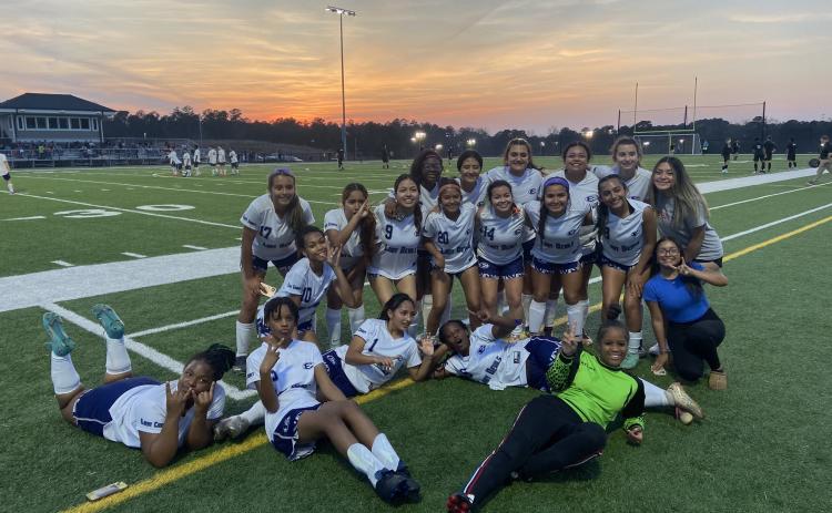 The Elbert County Lady Devils soccer team poses after they beat Barrow Arts and Sciences Academy 2-1 March 15. The Lady Devils are 3-2 in region play and hold onto third place after the big win. (Photo courtesy of the ECCHS Lady Devils Soccer Facebook page)